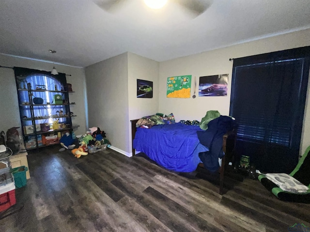 bedroom featuring hardwood / wood-style floors and ceiling fan