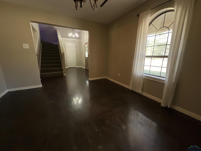 foyer featuring an inviting chandelier