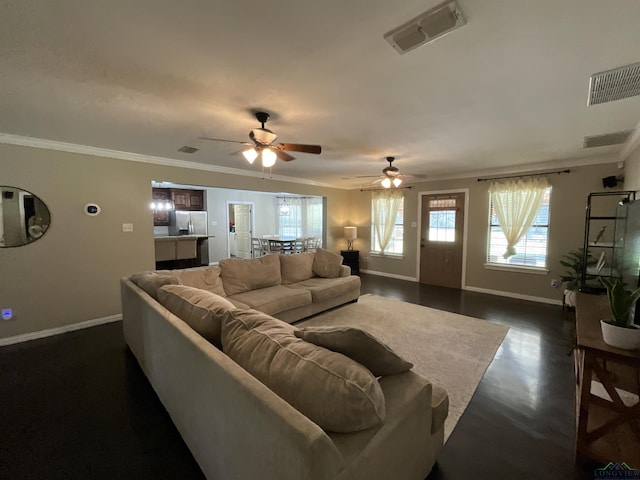 living room with crown molding and ceiling fan