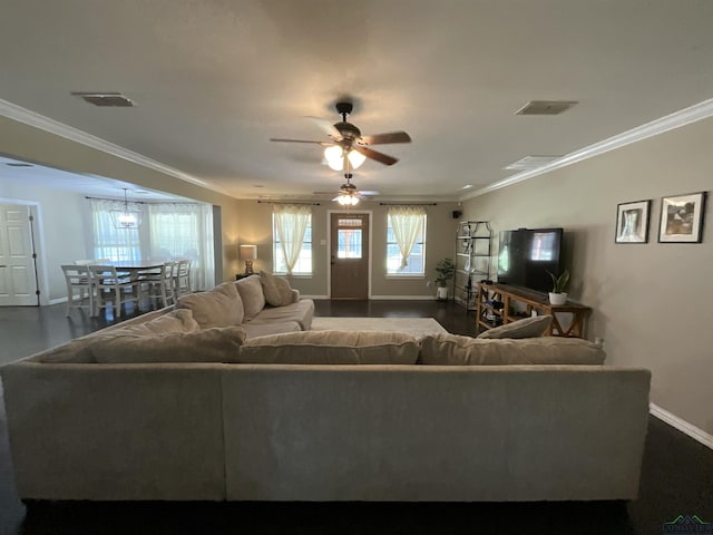 living room featuring ceiling fan and ornamental molding