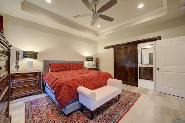 5112 Remington St, Texarkana, TX 75503 - bedroom featuring a tray ceiling, a barn door, crown molding, recessed lighting, and ensuite bath