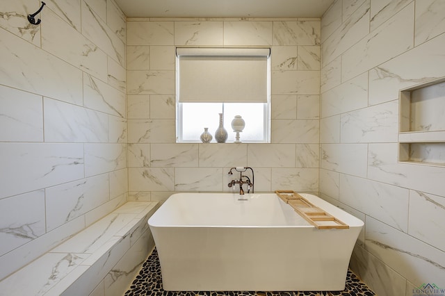 5112 Remington St, Texarkana, TX 75503 - bathroom with a soaking tub and tile walls