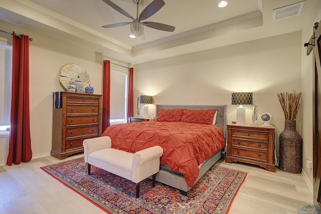 5112 Remington St, Texarkana, TX 75503 - bedroom featuring a barn door, wood finished floors, recessed lighting, ornamental molding, and a ceiling fan