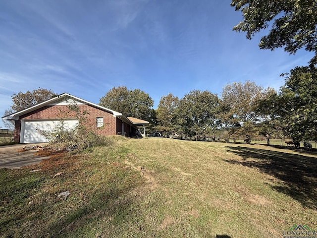 view of yard featuring a garage