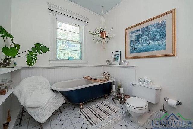 bathroom with toilet and a washtub