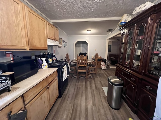 kitchen with light brown cabinets, a textured ceiling, dark wood-type flooring, and black appliances