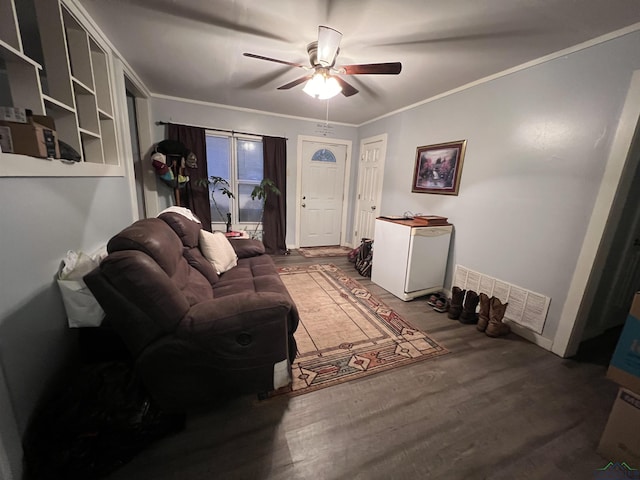 living room with ceiling fan, wood-type flooring, and ornamental molding