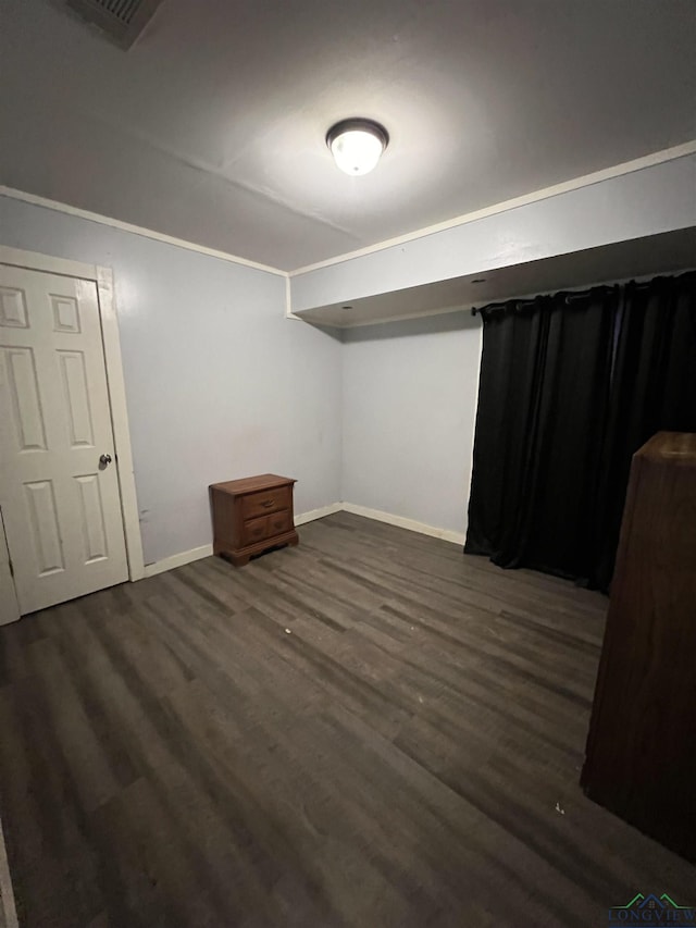 basement featuring dark wood-type flooring