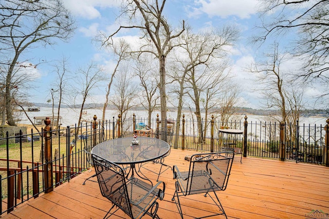 wooden deck featuring a water view