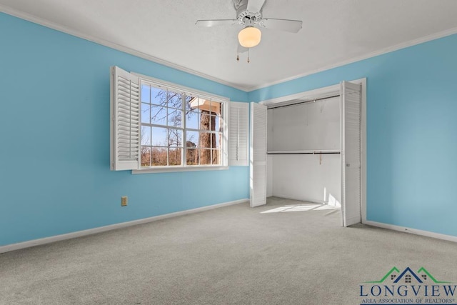 unfurnished bedroom with light carpet, a closet, ceiling fan, and ornamental molding