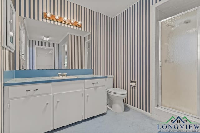 bathroom featuring an enclosed shower, vanity, crown molding, and toilet