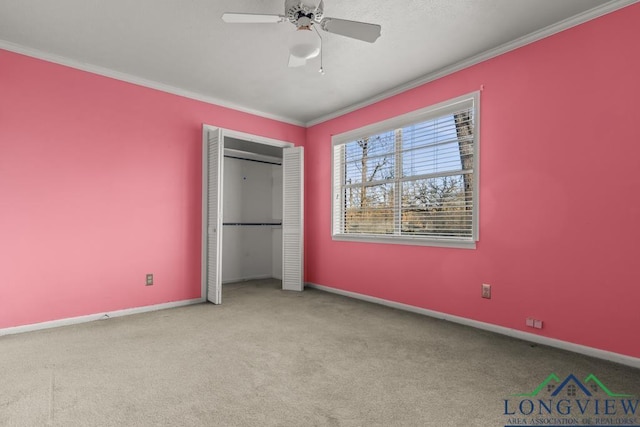 unfurnished bedroom with a closet, ceiling fan, light colored carpet, and ornamental molding