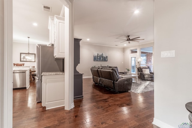 living area featuring visible vents, dark wood finished floors, a ceiling fan, crown molding, and recessed lighting