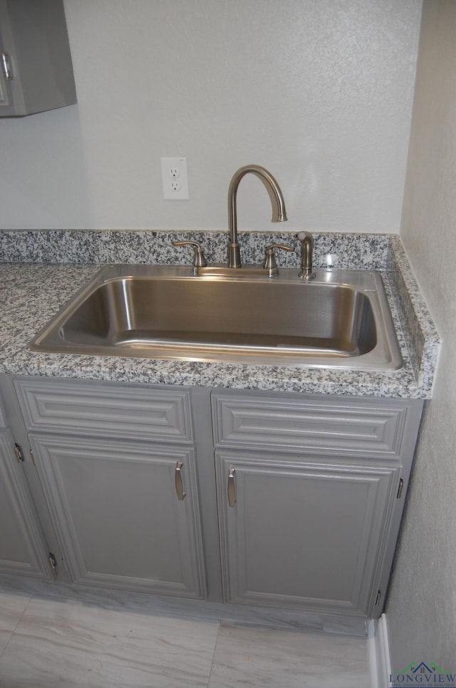 room details with gray cabinets and sink