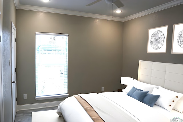 bedroom featuring ceiling fan, wood-type flooring, and ornamental molding