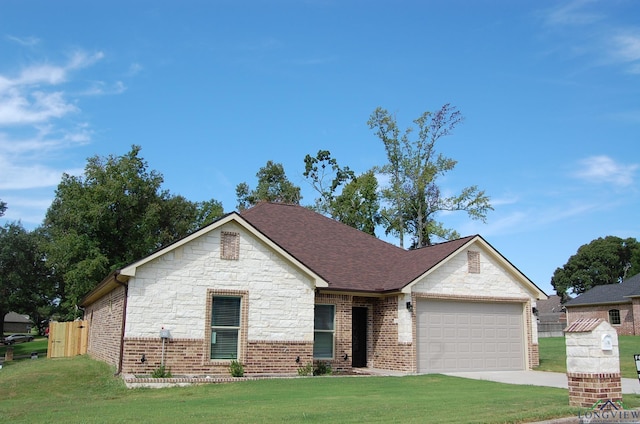 view of front of house with a front lawn and a garage