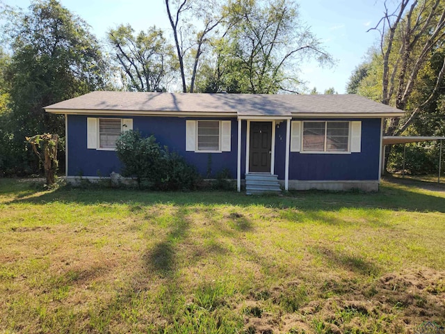 ranch-style house with a front lawn and a carport