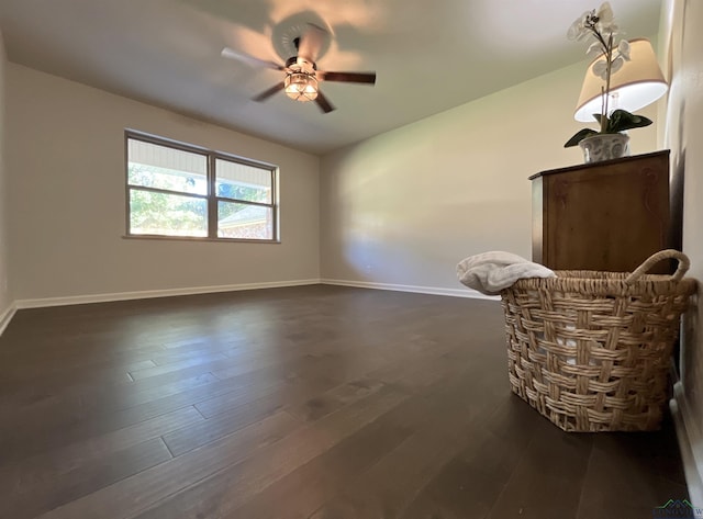 unfurnished room featuring dark hardwood / wood-style flooring and ceiling fan