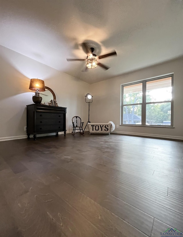 interior space featuring ceiling fan