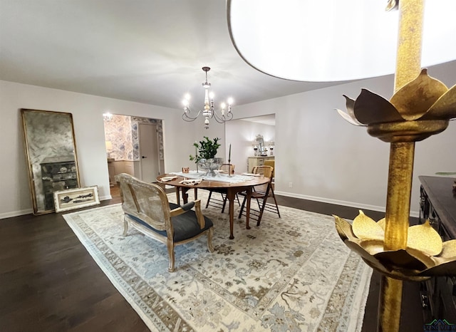 dining room featuring a chandelier and dark hardwood / wood-style floors