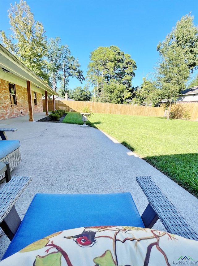 exterior space featuring a lawn and a patio area