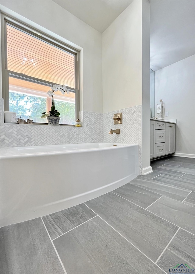 bathroom featuring a tub and vanity