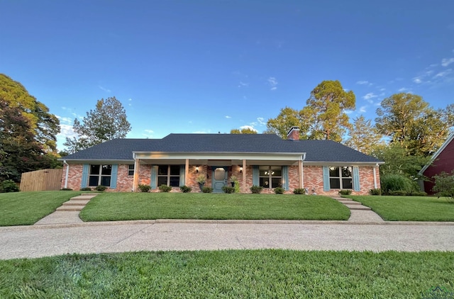 ranch-style house with a front lawn