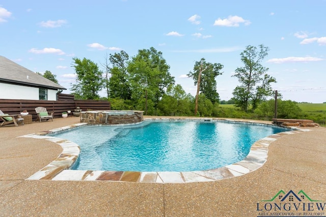 6056 Bobwhite Rd, Gilmer, TX 75645 - view of swimming pool with a pool with connected hot tub and a patio