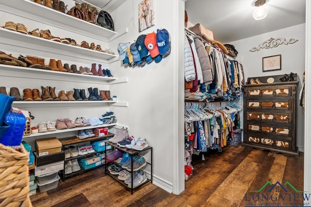 6056 Bobwhite Rd, Gilmer, TX 75645 - walk in closet featuring wood finished floors