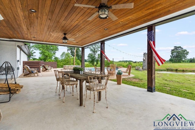 6056 Bobwhite Rd, Gilmer, TX 75645 - view of patio with outdoor dining space and ceiling fan