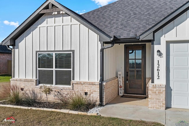 view of exterior entry with a garage