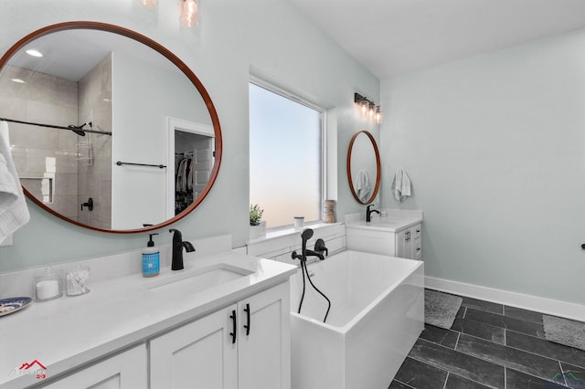 bathroom featuring vanity and shower with separate bathtub