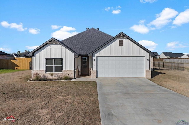 view of front of property featuring a front lawn and a garage