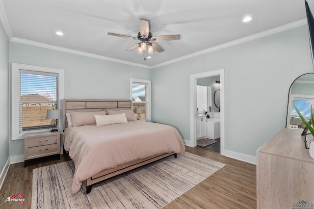 bedroom with connected bathroom, ceiling fan, dark hardwood / wood-style flooring, and ornamental molding