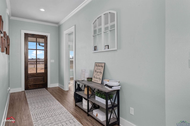 entrance foyer featuring dark hardwood / wood-style floors and ornamental molding