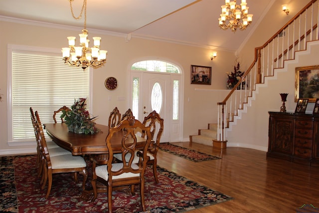 dining space featuring crown molding, dark wood-type flooring, and an inviting chandelier