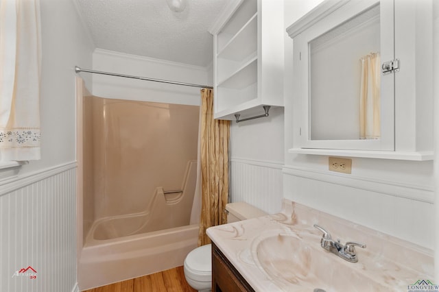 full bathroom featuring shower / bath combination with curtain, a textured ceiling, toilet, vanity, and hardwood / wood-style flooring