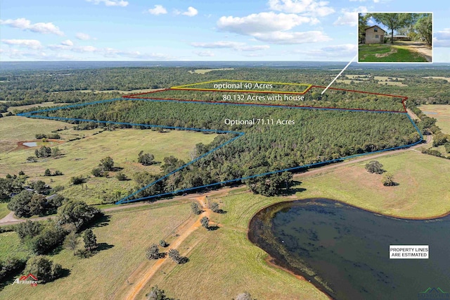 birds eye view of property with a rural view