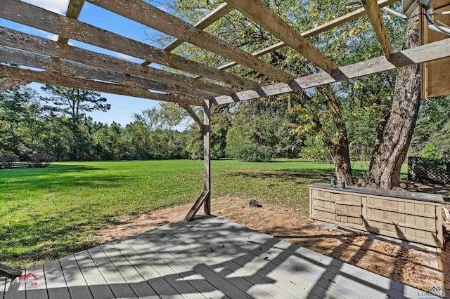 wooden deck featuring a pergola and a yard