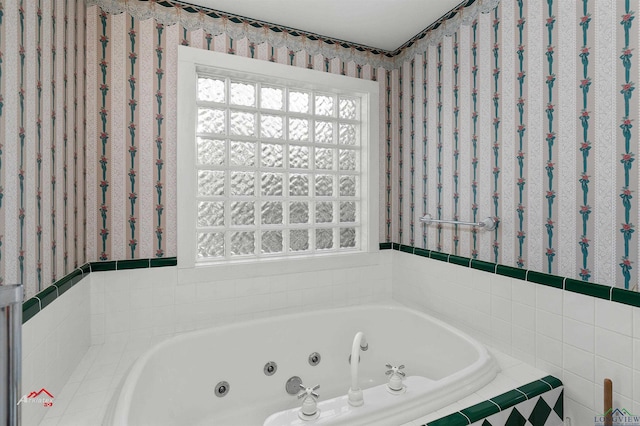 bathroom featuring tiled tub