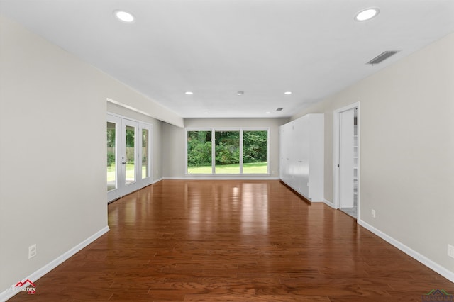 3408 Airline Rd, Longview, TX 75605 - spare room featuring french doors, wood finished floors, and recessed lighting