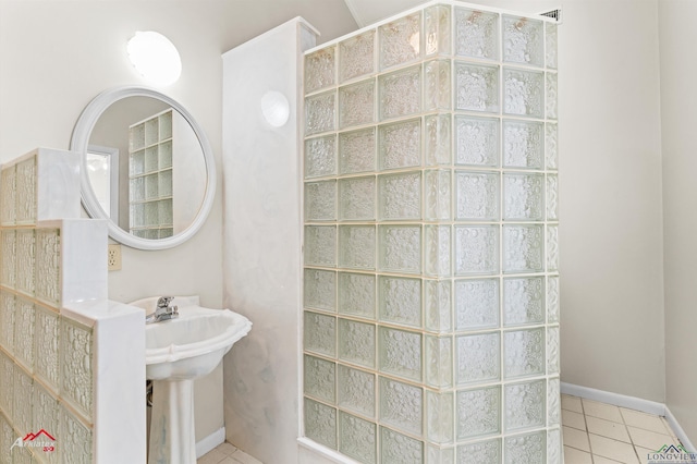 3408 Airline Rd, Longview, TX 75605 - bathroom featuring tile patterned floors and a walk in shower