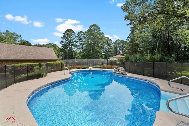 3408 Airline Rd, Longview, TX 75605 - view of swimming pool featuring view of wooded area and a patio