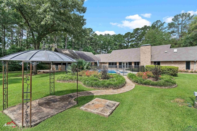 3408 Airline Rd, Longview, TX 75605 - rear view of house featuring a chimney