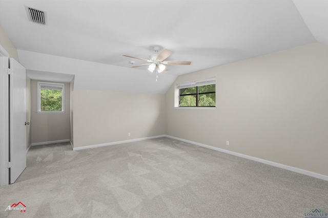 3408 Airline Rd, Longview, TX 75605 - spare room with vaulted ceiling, ceiling fan, light colored carpet, and plenty of natural light