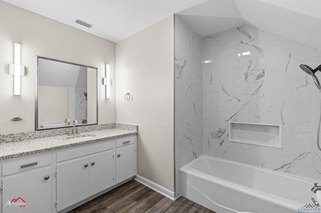 3408 Airline Rd, Longview, TX 75605 - full bath featuring vanity, wood finished floors, and shower / bath combination