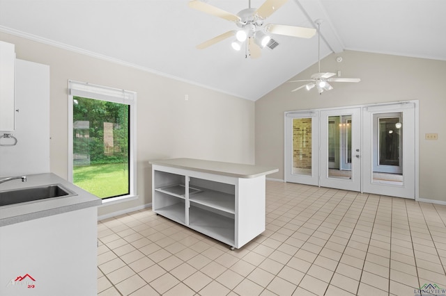 3408 Airline Rd, Longview, TX 75605 - kitchen with open shelves, light countertops, light tile patterned flooring, ceiling fan, and ornamental molding
