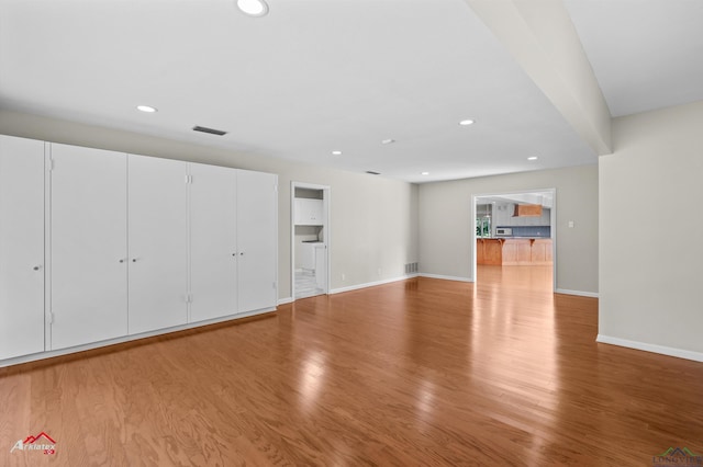 3408 Airline Rd, Longview, TX 75605 - unfurnished living room featuring light wood finished floors and recessed lighting