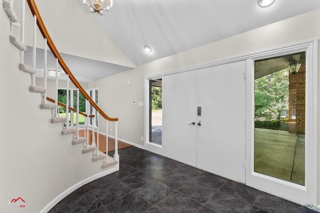 3408 Airline Rd, Longview, TX 75605 - entrance foyer featuring plenty of natural light, stone finish flooring, vaulted ceiling, and stairway