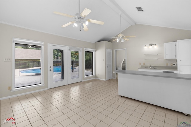 3408 Airline Rd, Longview, TX 75605 - kitchen with light countertops, white cabinetry, light tile patterned flooring, ceiling fan, and crown molding